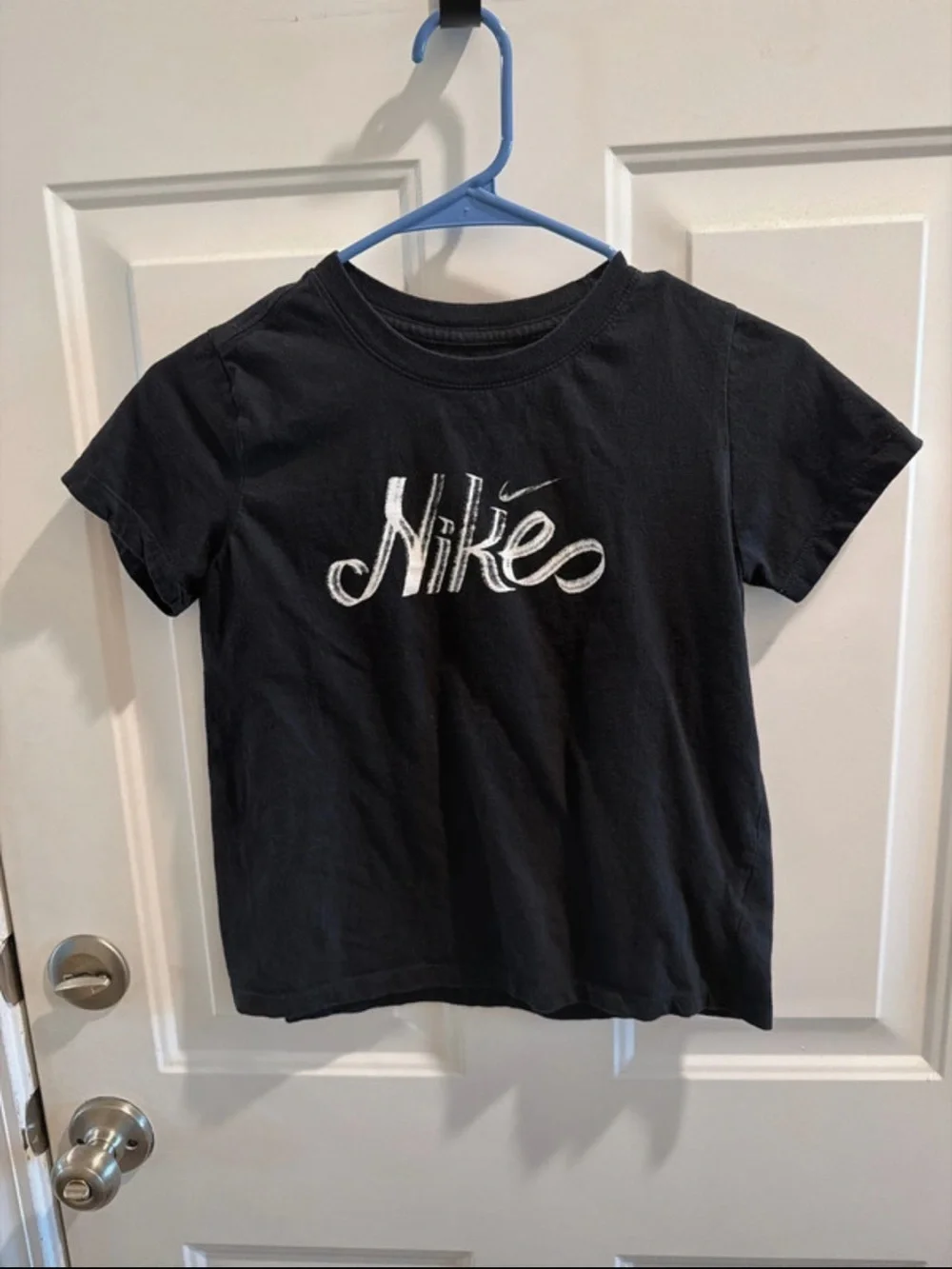 Nike Black Short Sleeve Kids Logo Tee with White Embroidered Script